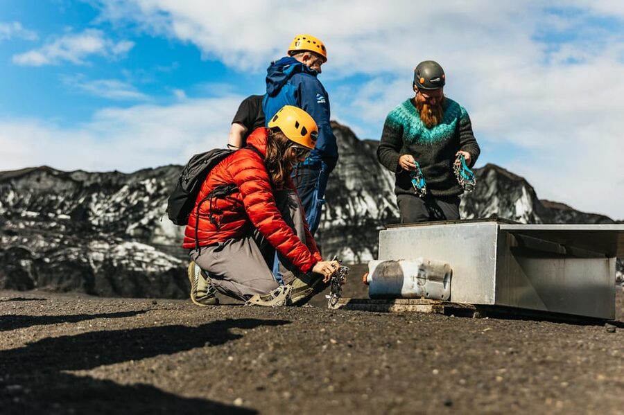 From Vik: Katla Ice Cave and Super Jeep Tour - Inside Katla Ice Cave: blue ice and volcanic ash in the same frame