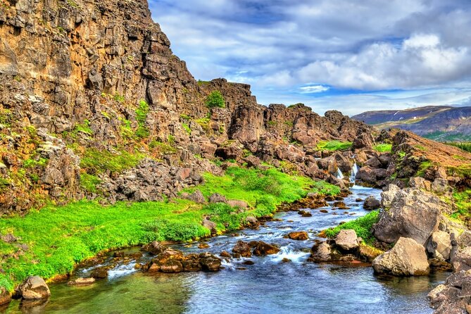Golden Circle Private Tour with Kerid & Faxi Waterfall: Reykjavik - Þingvellir National Park, walking between tectonic plates and Althingi history