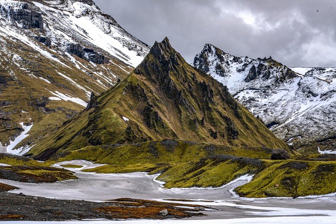 Ice Cave at Katla Volcano - Inside the cave: narrow passages, board bridges, and ice that changes