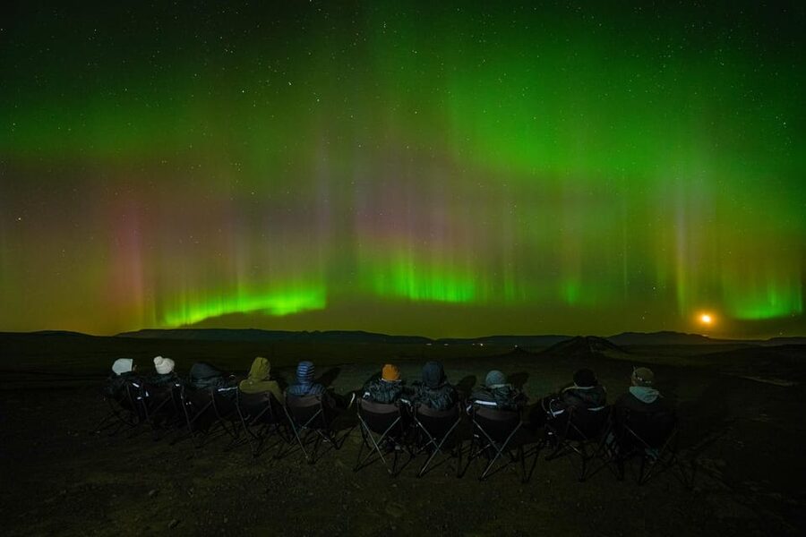 Reykjavik: Northern Lights Tour with Private Photographer - Small group size, pickup, and escaping city light spill
